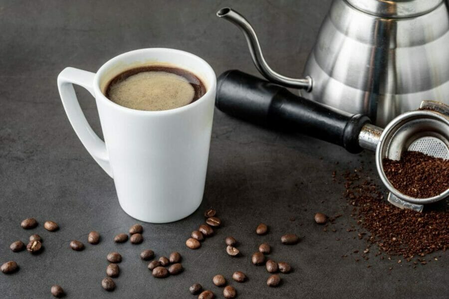 Americano coffee on a table with coffee beans