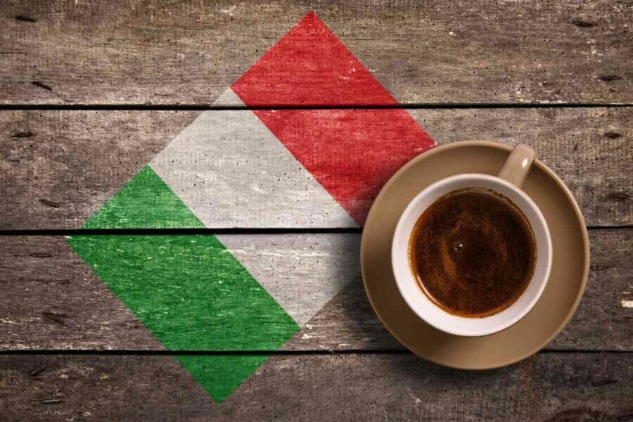 Coffee cup on a table featuring an Italian flag graphic